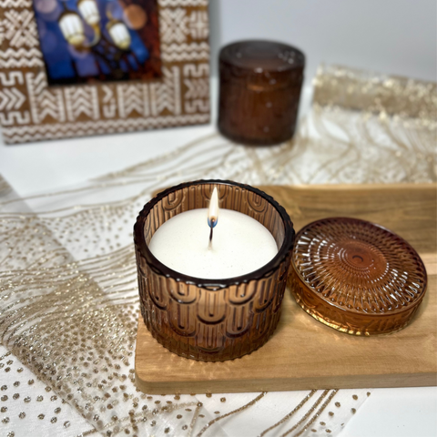Vela aromática en recipiente de cristal